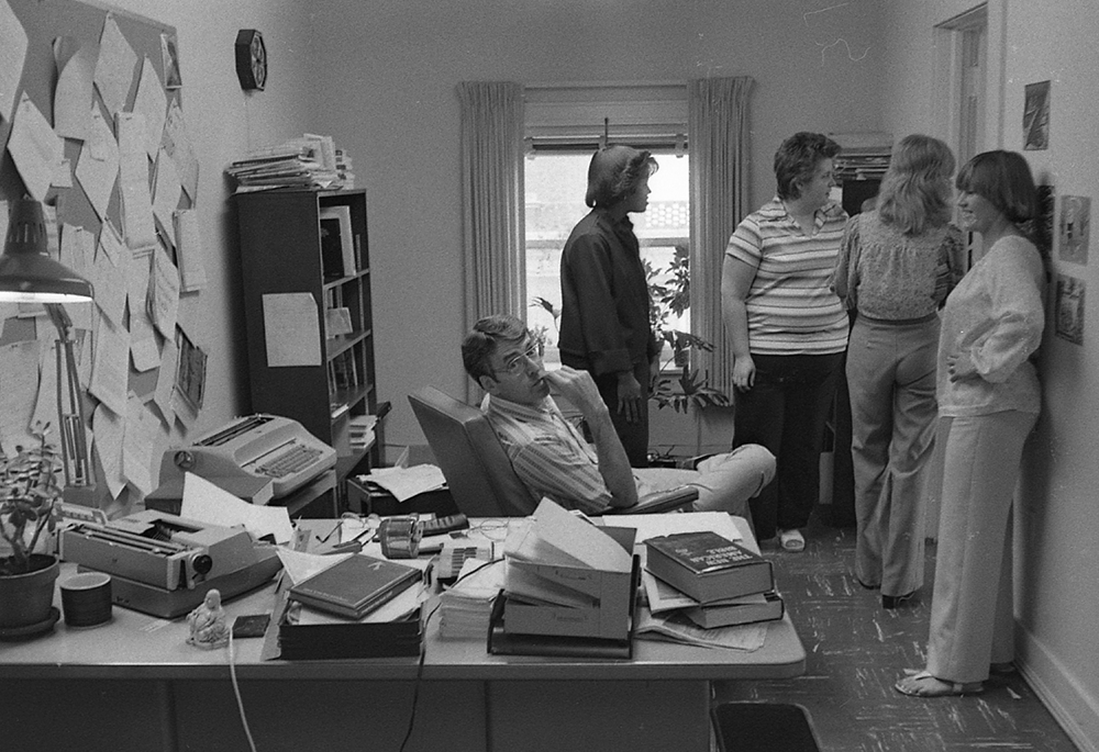 Art Winter, who served on NCR's editorial staff from 1966-1974 and later edited Celebration, NCR's liturgy service, is pictured seated with other staff members of the NCR Publishing Company in 1978, at NCR's offices in Kansas City, Missouri. (NCR file photo)